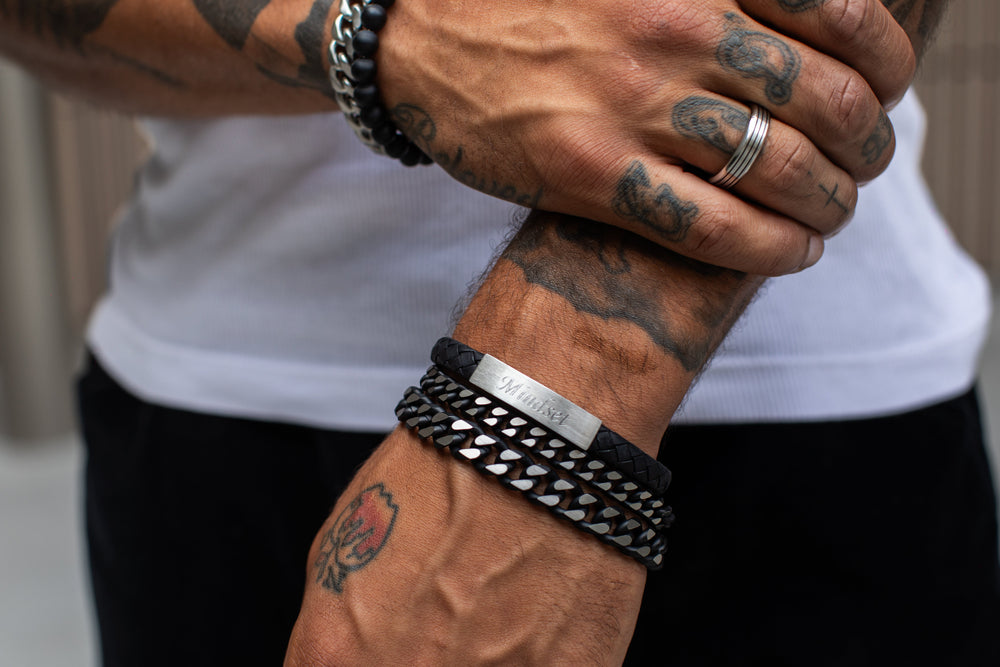 Engravable stainless steel bracelet for men with personalized engraving on a dark surface