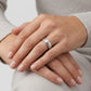 Enhanced Close-up of a 6mm stainless steel wedding ring with milgrain detailing and polished finish.  