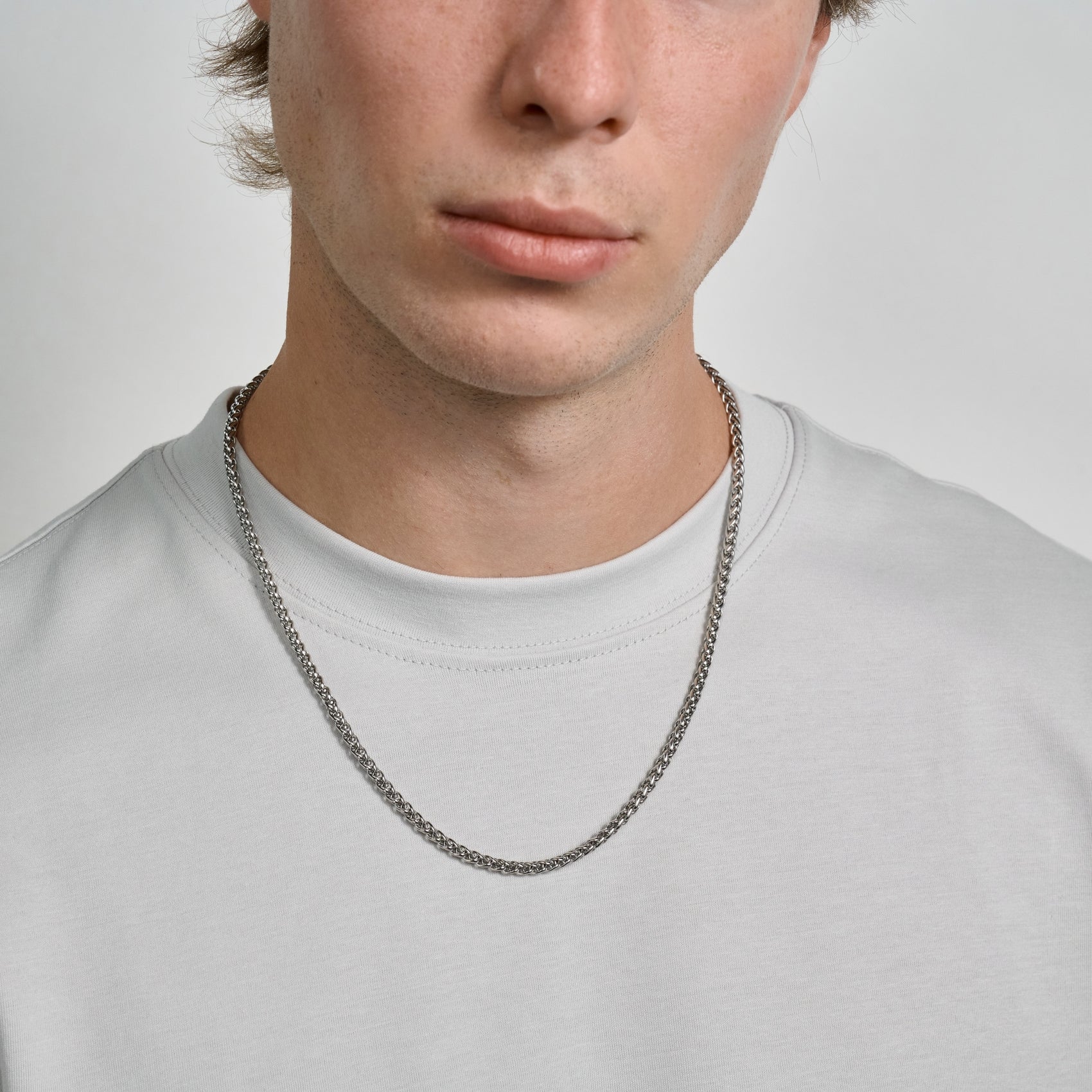 Close-up of a men's 4mm wheat chain crafted from polished stainless steel  