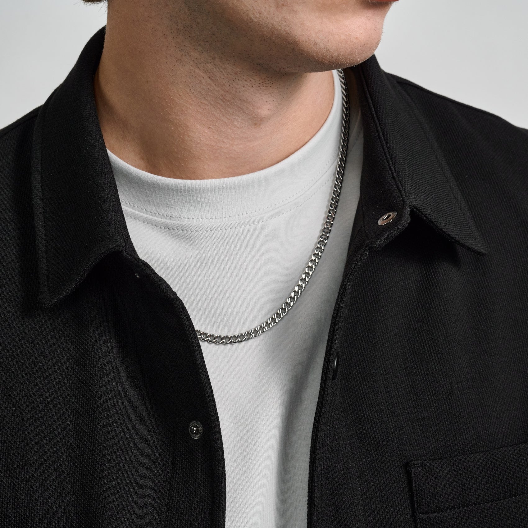 Unisex 5mm Cuban link chain made of durable stainless steel, shown on a white background  