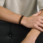 Detailed shot of men's bracelets showcasing durable stainless steel and organic Tiger Eye beads  