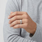 Enhanced Close-up of a polished 5mm stainless steel domed wedding band with detailed milgrain edges.  