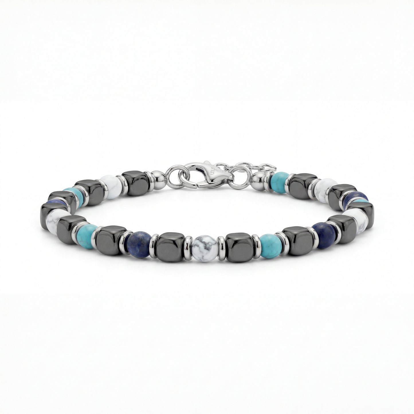 Close-up of Glacier Stone Bracelet featuring 5mm white turquoise, sodalite, and hematite beads with stainless steel spacers and an adjustable clasp on a white background.