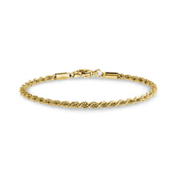 Close-up angle of thin gold-tone rope chain bracelet with lobster clasp