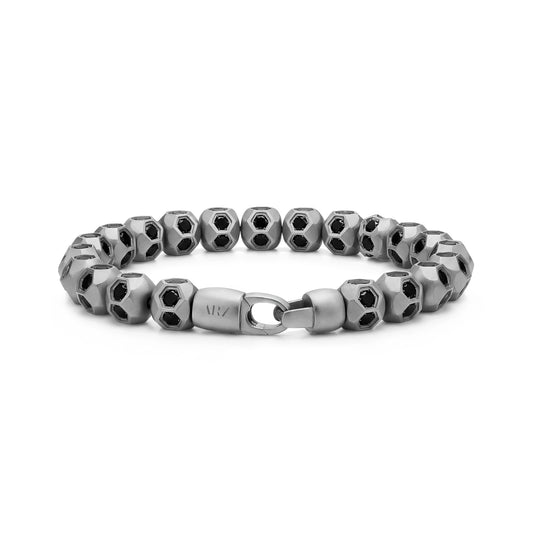Matte silver soccer bead bracelet displayed with a focus on the branded gunmetal clasp and detailed stones