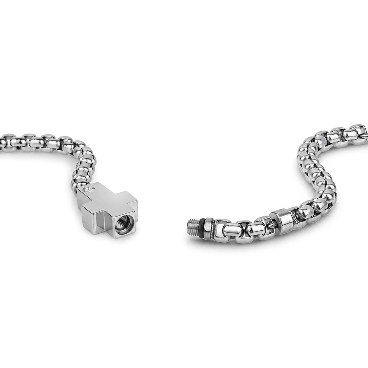 Silver cross-shaped urn bracelet with a lab diamond accent on a 4mm box link chain, cross charm conceals a hidden ash capsule