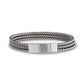 Close-up of the engravable matte silver clasp on the brown and silver woven steel bracelet