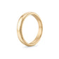 Styled image of stainless steel milgrain wedding band beside wedding accessories emphasizing timeless design