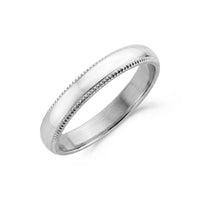 Close-up of a polished stainless steel 4mm domed wedding band with detailed milgrain edges  