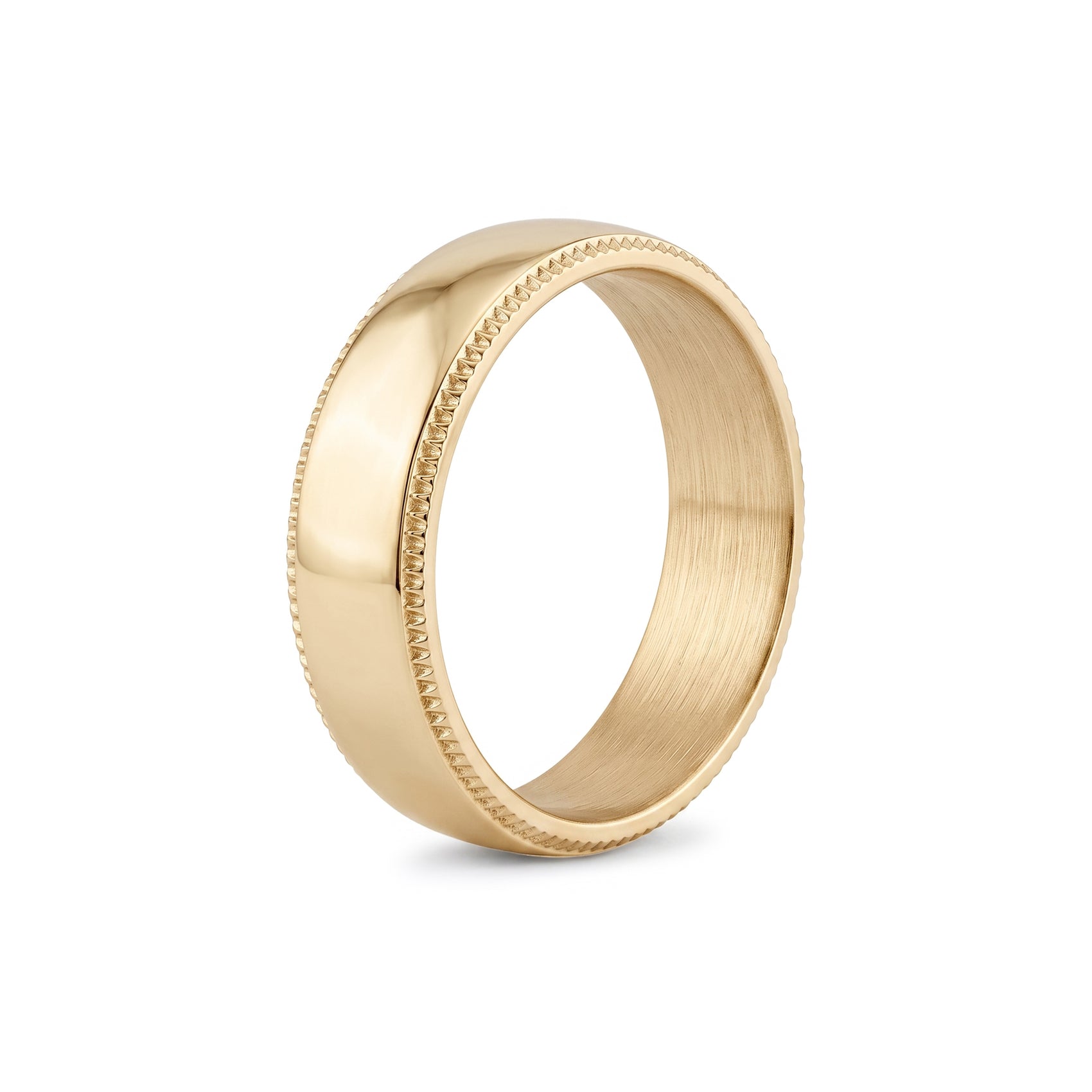 Detailed macro shot of the textured milgrain pattern on the edges of a stainless steel wedding ring