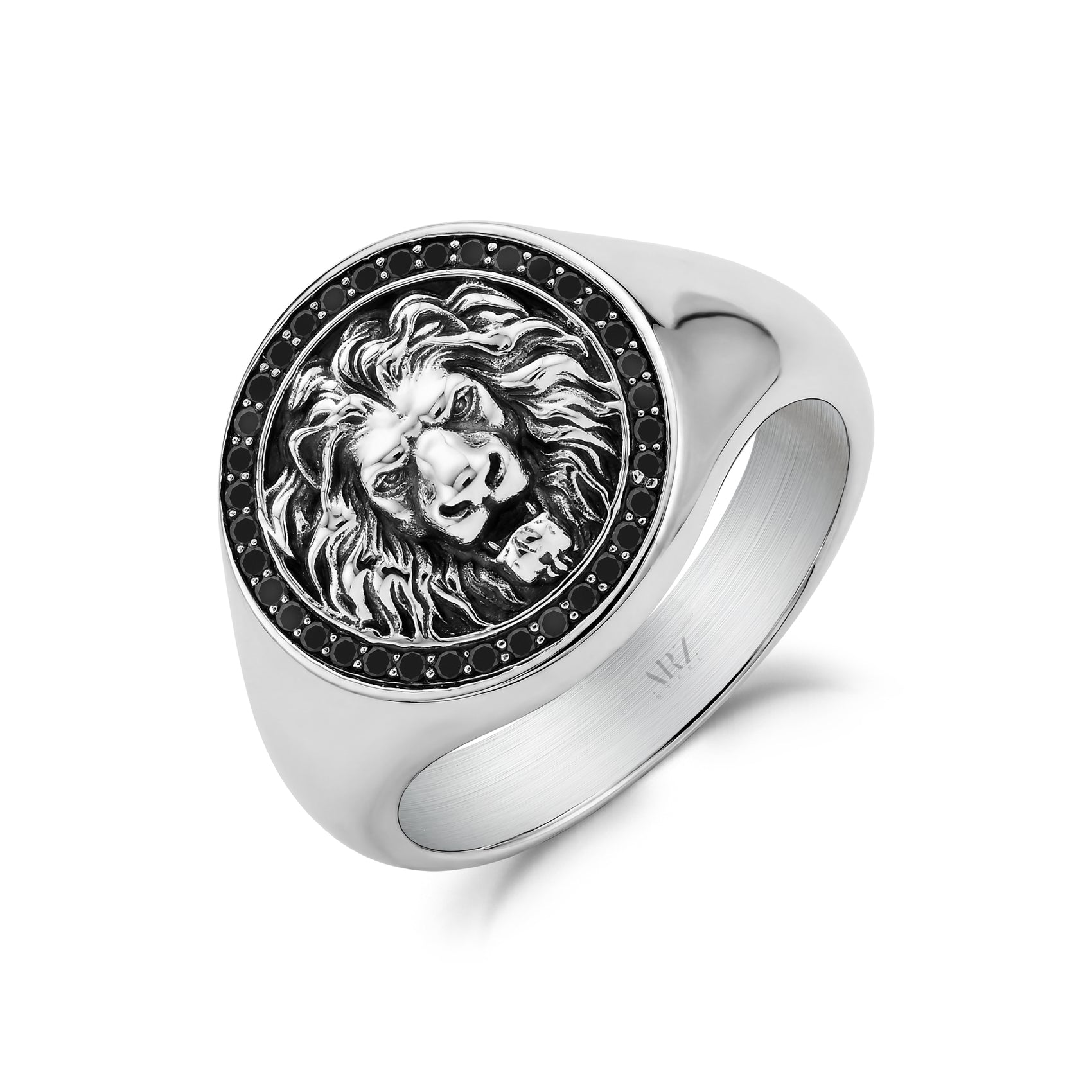 A silver-toned signet ring featuring an embossed lion head in relief, surrounded by a border of small black stones, shown on a clean white background.