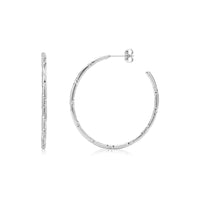 Faceted slim hoop earrings in shiny silver stainless steel with 42mm diameter, shown from front and side views
