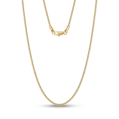 Minimalist 2mm stainless steel box link chain laying flat against a neutral background  