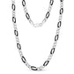 Shiny 7mm Figaro link chain necklace coiled neatly with focus on craftsmanship