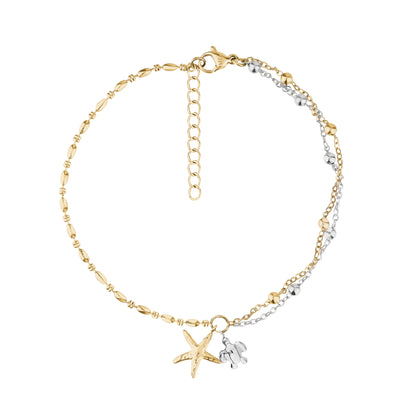 Two-tone gold and silver charm bracelet with starfish and turtle charms on white background