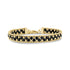 Woven bead link bracelet made of gold-tone stainless steel and black spinel beads with a lobster clasp