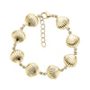 Gold stainless steel seashell link bracelet with adjustable chain clasp laid flat