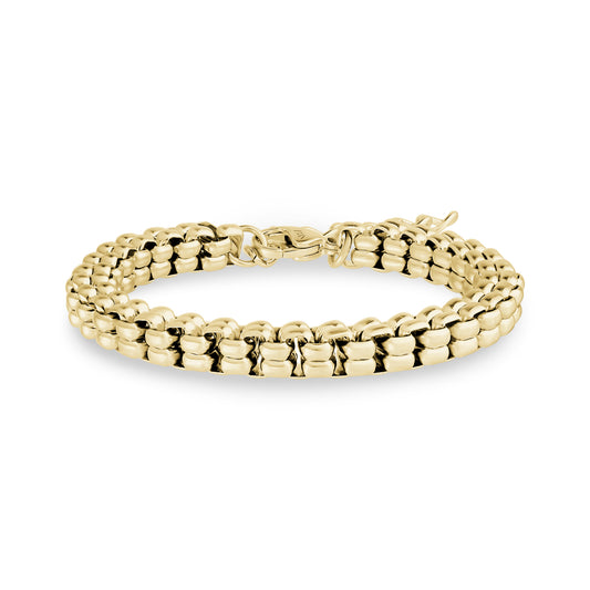 Polished yellow gold tone block link bracelet with lobster clasp closure, 7mm wide, displayed on white background