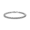 Close-up of silver interlaced link steel bracelet lying flat with lobster clasp visible