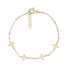 Dainty stainless steel cross bracelet in gold with five cross charms and adjustable chain