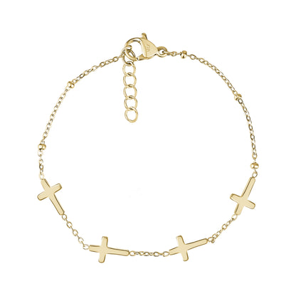 Dainty stainless steel cross bracelet in gold with five cross charms and adjustable chain
