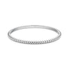 Silver tone women's bubble edge bangle bracelet with smooth rounded bubble details around edges on white background
