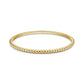 Gold tone women's bubble edge bangle bracelet featuring rounded bubble edge design on white background