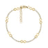 Gold tone infinity station tennis bracelet with matte infinity symbols and clear cubic zirconia stones on a white background