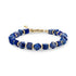 Geometric lapis lazuli stone bead bracelet with gold stainless steel accents and lobster clasp on a white background
