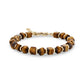 Geometric brown tiger eye stone bead bracelet with gold stainless steel accents and lobster clasp on a white background