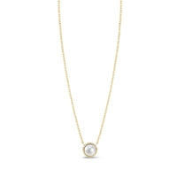 Gold tone stainless steel necklace with round mother of pearl pendant on white background