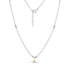 Close-up of silver beaded necklace featuring a mini gold star pendant with adjustable chain