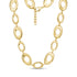 Close-up of polished gold stainless steel bold oval link statement necklace with lobster clasp and extension chain