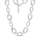 Close-up of polished silver stainless steel bold oval link statement necklace with lobster clasp and extension chain