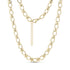 Close-up of structured link necklace in gleaming gold stainless steel with oval and cross-shaped links, showing lobster clasp and extension chain