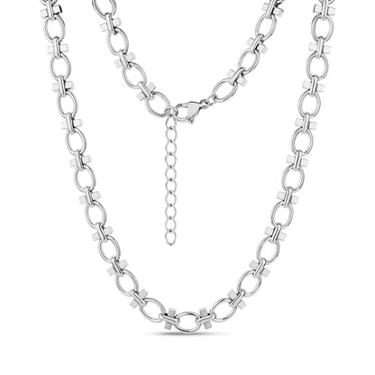 Close-up of structured link necklace in shiny silver stainless steel with oval and cross-shaped links, showing lobster clasp and extension chain