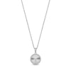 Close-up of silver cubic zirconia round pendant showing stone detail and engravable back plate