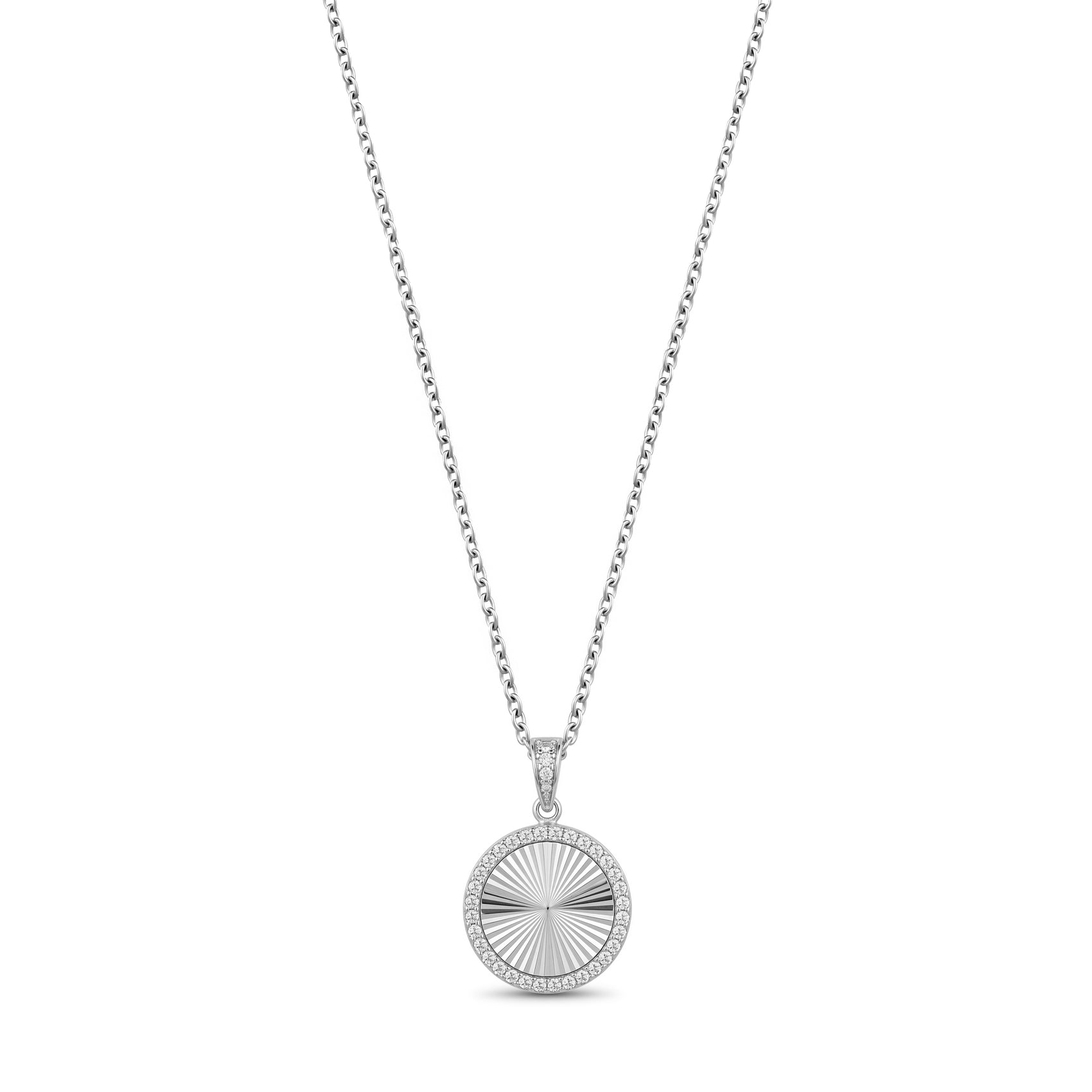 Close-up of silver cubic zirconia round pendant showing stone detail and engravable back plate