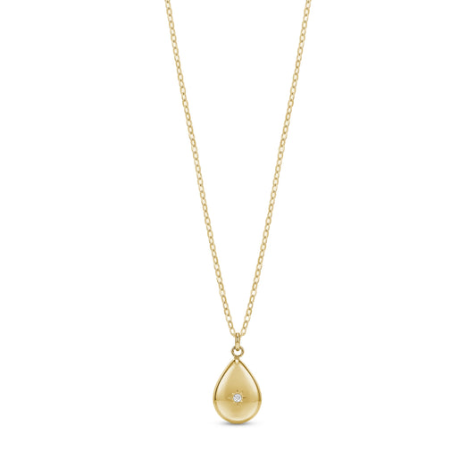 Gold celestial teardrop pendant necklace with crystal detail on a fine chain