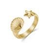 Gold seashell and starfish open ring showcasing polished stainless steel finish