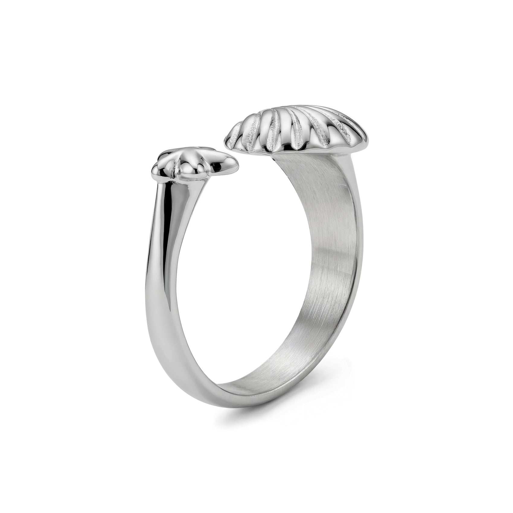 Side angle showing silver open ring's curved band with starfish and seashell