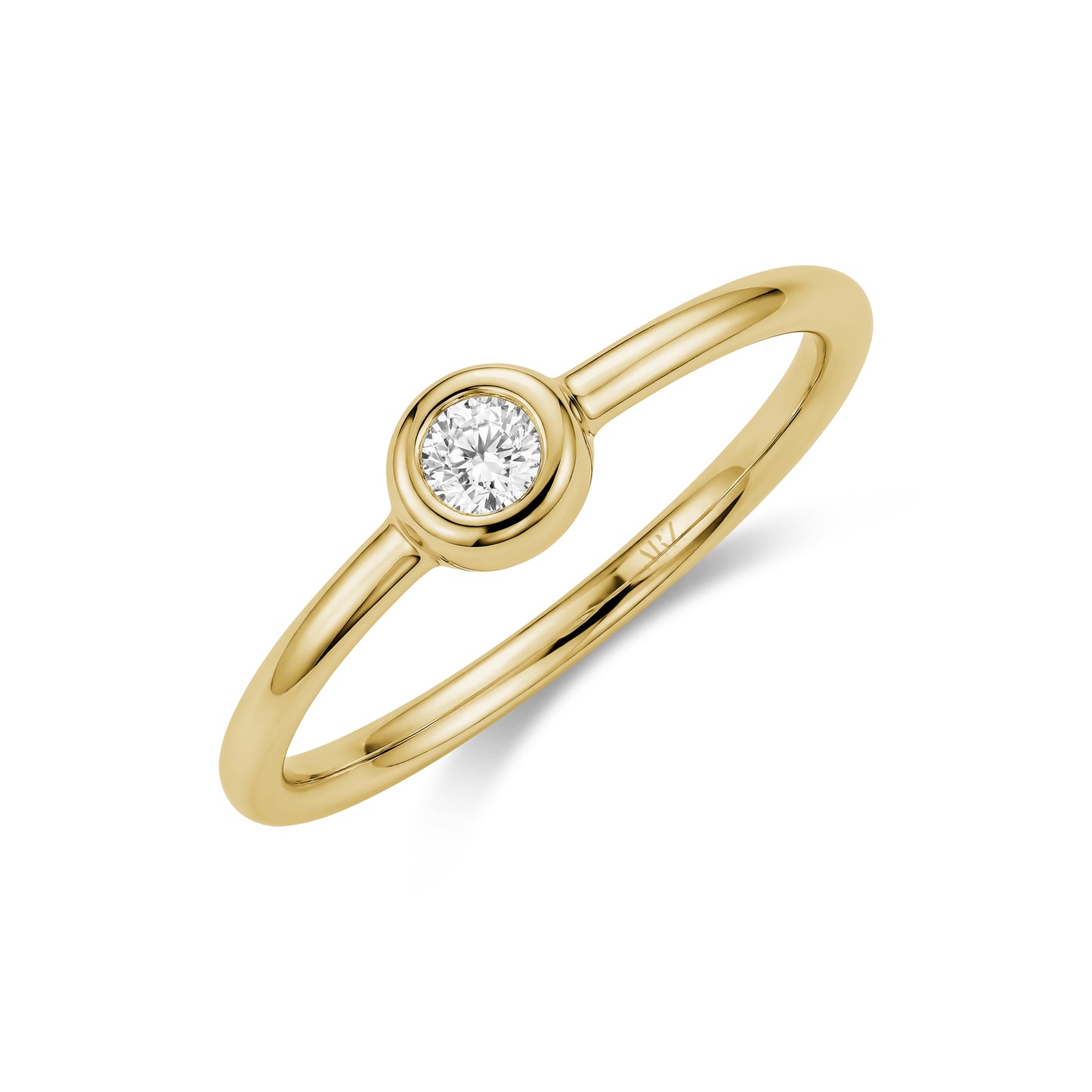 Close-up angled view of gold tone bezel set solitaire women’s ring with 3mm cubic zirconia