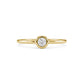 Front view of gold tone bezel set solitaire women’s ring featuring a centered 3mm cubic zirconia