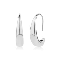 Silver sculpted teardrop hook earrings showing smooth polished finish and curved design