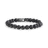 Close-up view of black matte and shiny onyx bead bracelet with matte gunmetal steel clasp