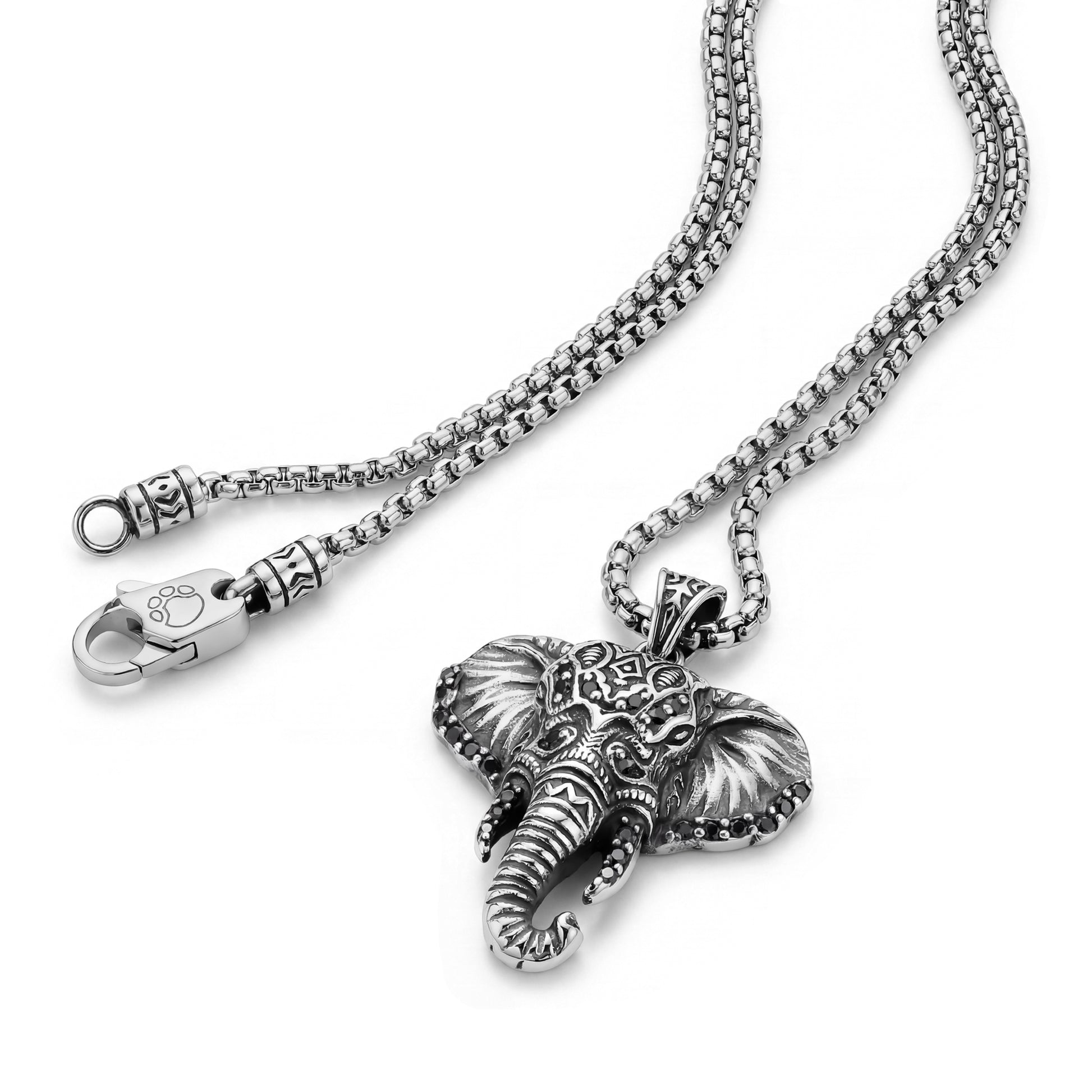 Close-up of detailed elephant pendant and decorative clasp on stainless steel 22 inch box link chain