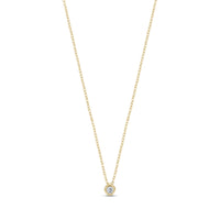 Gold minimalist bezel set solitaire pendant necklace with cubic zirconia on adjustable chain