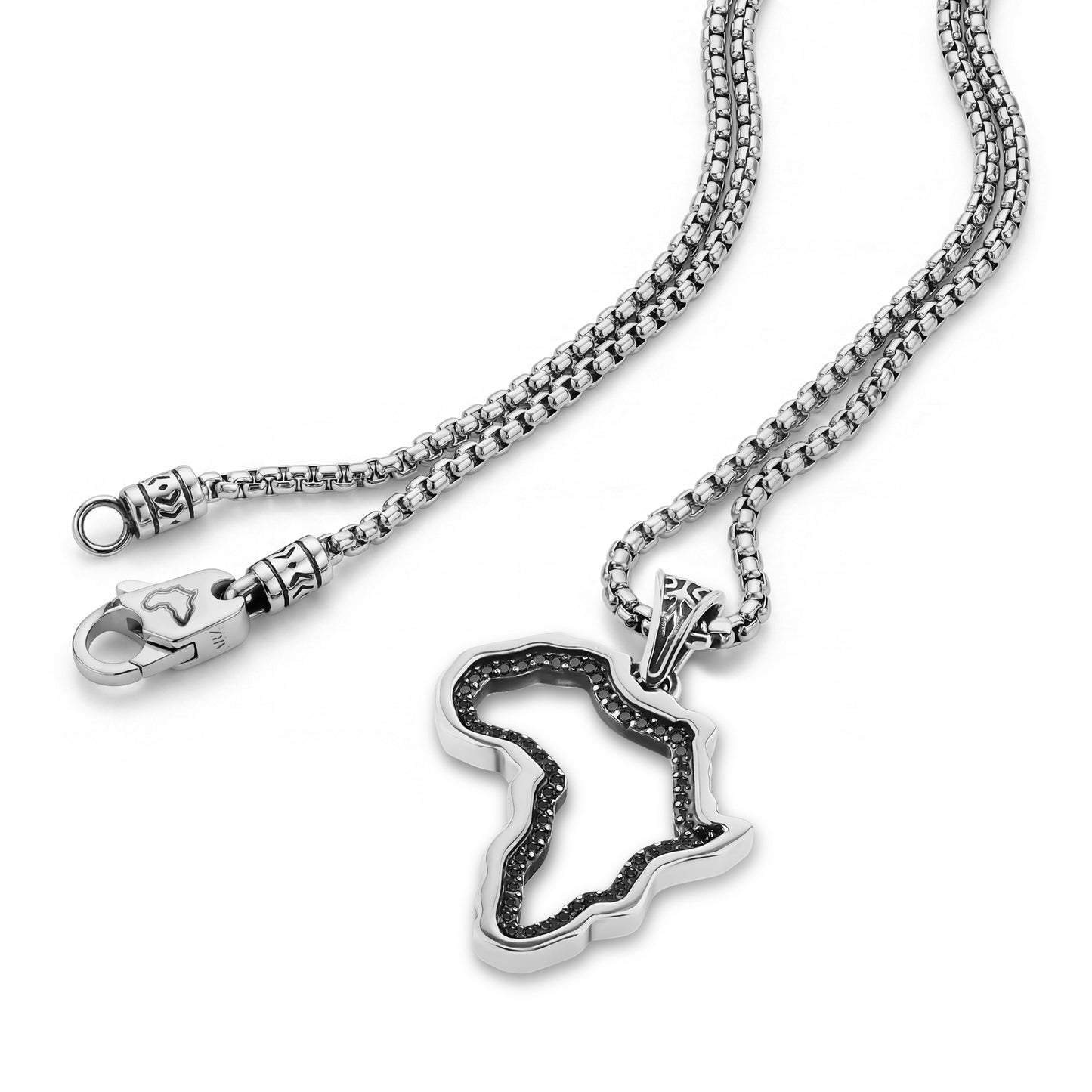 Close-up of silver Africa map pendant and detailed clasp on round box link chain.