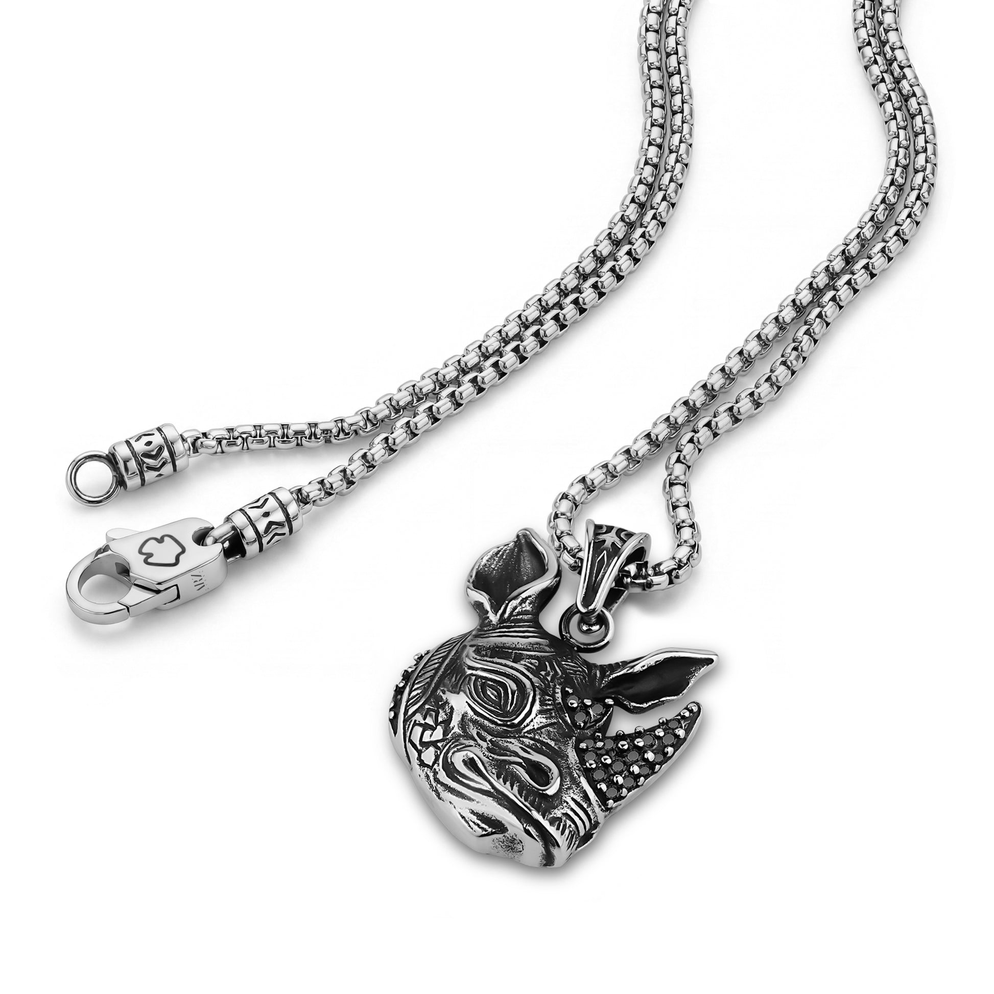 Close-up of detailed stainless steel round box link chain and intricate pendant bail with clasp