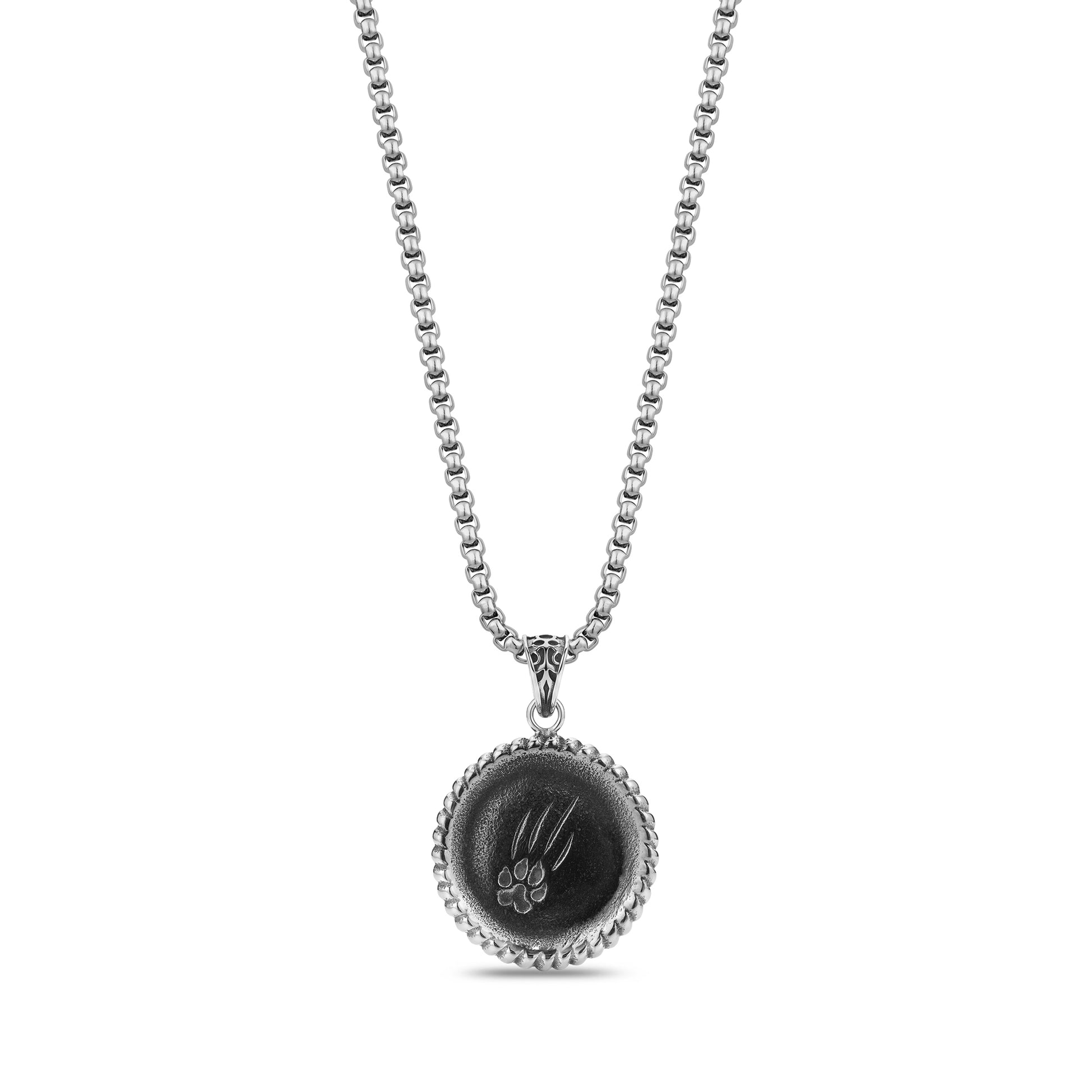 Back view of lion pendant showing engraved claw mark design on stainless steel surface